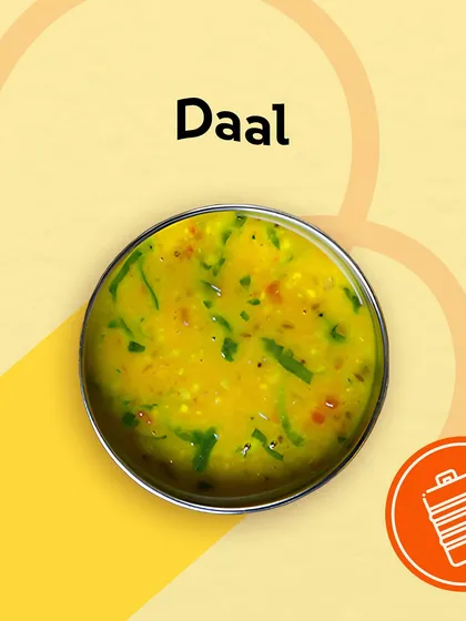 A vibrant bowl of yellow dal, tempered with spices and garnished with herbs. It's the soul of our tiffin service, providing comfort and nutrition in every spoonful.