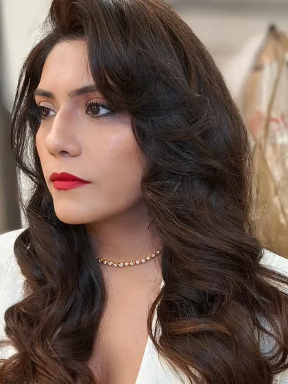 A bold red lip and vintage waves are a timeless combination for any special occasion. This look is perfect for a cocktail party or sangeet when you want to feel confident and make a statement.