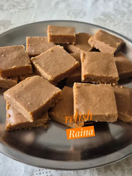 A simple, un-garnished version of Gur Papdi on a plate, showcasing its beautiful texture and color.