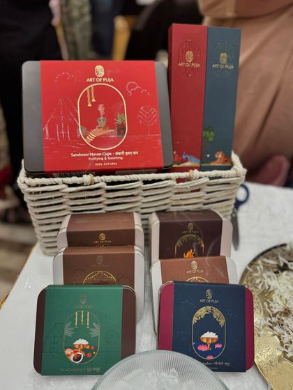 A beautifully arranged stall for 'Art of Puja', offering natural and pure incense and havan cups, catering to a niche lifestyle need.