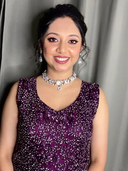 A simple and elegant look for a reception or cocktail party. The makeup is fresh and minimal, with a focus on a healthy glow.