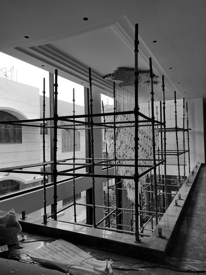 A glimpse of our architectural work in progress. This double-height space with its grand staircase and skylight is taking shape, showcasing the structural planning and attention to natural light that are central to our design philosophy.