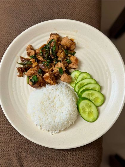 A repeat of the delicious Thai basil chicken with steamed rice and cucumber.