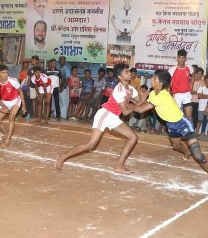 An action shot from a sub-junior match, showing a defender trying to stop a raider.