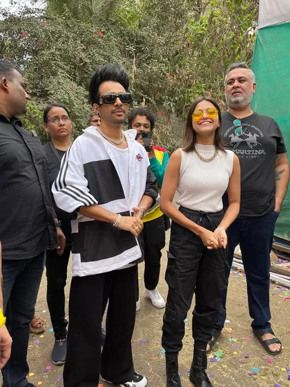 A candid interaction between the artists at the Holi event.