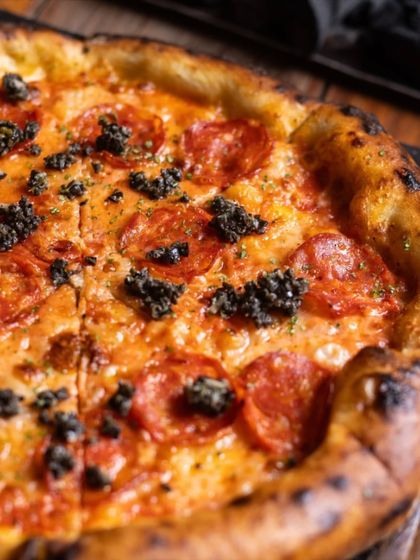 When life gets complicated, keep it simple with a classic Pepperoni Pizza, topped here with a delicious black olive tapenade for an extra layer of flavour.