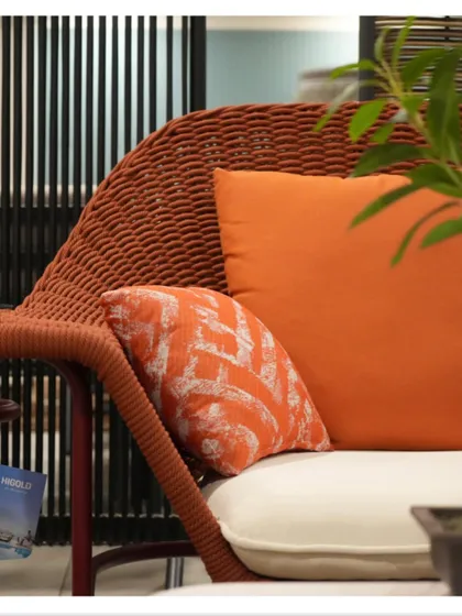 A close-up shot from my collaboration with Cairo Indoor Outdoor. The vibrant orange cushion and textured wicker of this chair are perfect for adding a pop of color and natural texture to a space.