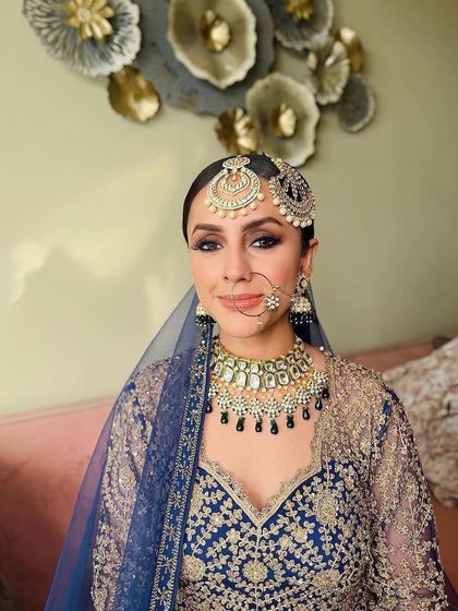 A close-up portrait showing the beautiful winged eyeliner and defined brows. A perfect look for any festive occasion.