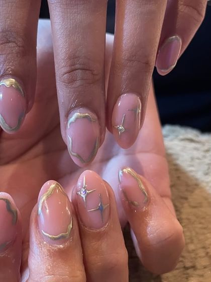 An elegant and artistic design. A soft pink base is decorated with abstract silver chrome outlines and tiny starburst accents, perfect for a sophisticated event.