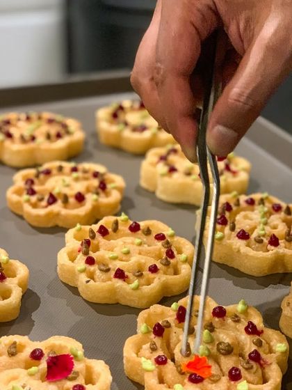 Beautifully shaped rosettes made with umami paste and dotted with beetroot and avocado puree, showcasing the artistry in my canapés.