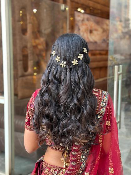 A clear shot of the back, showcasing the full hairstyle which is perfect for a bride or bridesmaid.