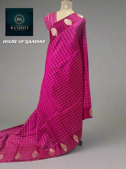 A beautiful rani pink checks pattern pure Banaras lightweight silk saree.