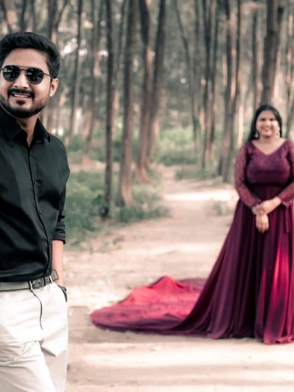 A quiet moment together in nature. The rich color of this wine trail gown stands out beautifully against the soft, wooded background.