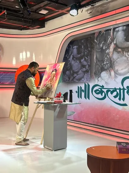 Here I am during a live painting session on Saam TV for their "Kaladhipati" program. I was invited to create a painting of Ganesha, and I chose to portray him as "Bal Ganesh," inspired by my own young son, Yuvraj.