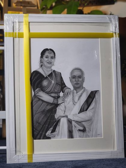 The finished portrait, framed in white and ready for delivery.