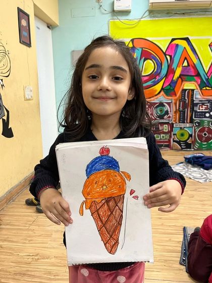 An ice cream cone that looks good enough to eat! This drawing was made during a fun session where we learned to draw our favorite foods.