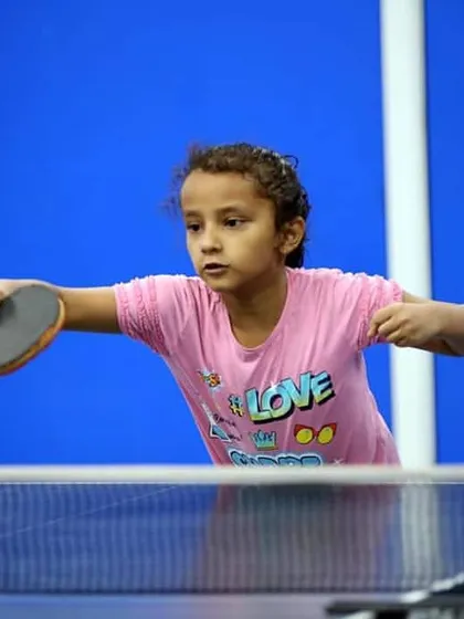 This young player is focused on her backhand return. We start with the basics of grip and posture to ensure every student develops a strong technical foundation for their game.