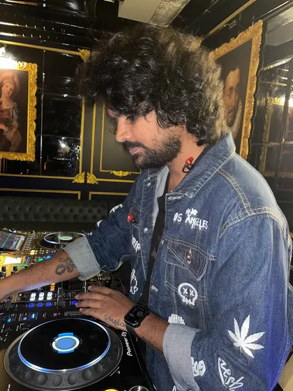 A close-up shot showing my focus and style while I'm mixing tracks and controlling the dance floor.