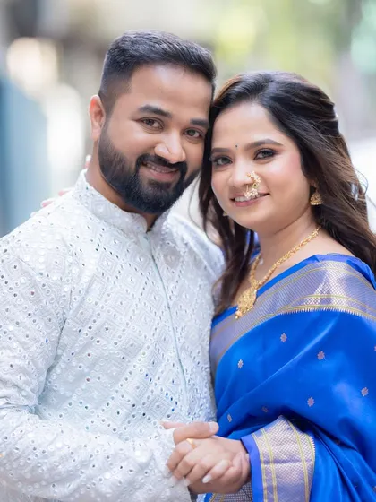 A happy couple portrait. The bride's makeup is minimal and elegant, letting her natural joy shine through on their engagement day.