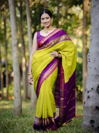 Every saree tells a story. This pure Mysore crepe in a lime green and purple combination is a timeless classic, perfect for any occasion.