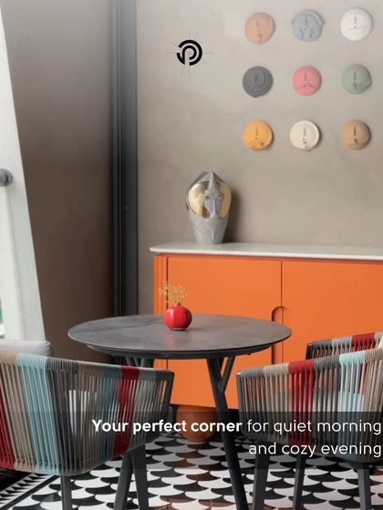 Every corner in The Aura House tells a story. Here, colorful woven chairs, a bright orange console, and a unique wall art installation create a perfect spot for quiet mornings and cozy evenings.