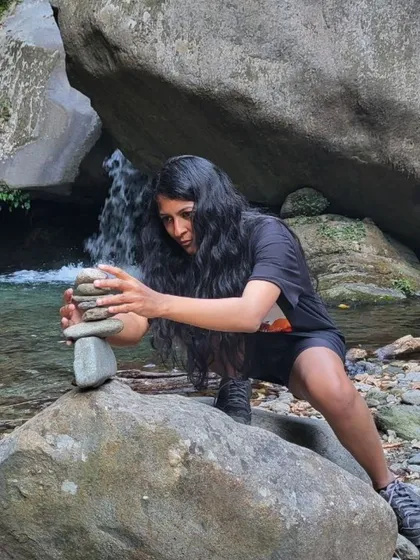 Finding balance, one stone at a time. For me, yoga is about creating moments of focus and stillness, whether on the mat or by a stream in the Himalayas. This practice of mindfulness is something I bring into every class.