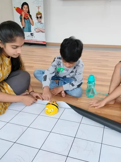 Young learners at our Whitefield center use a screen-free Bee-Bot, learning coding fundamentals like sequencing and direction in a fun, tactile way.