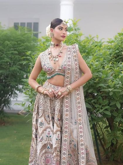 A full-length shot of the Laila lehenga, showcasing its beautiful motifs and the elegant way it is styled.