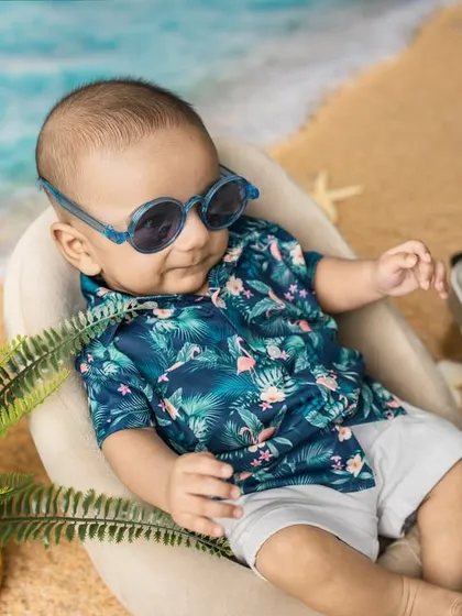 Leaning back and enjoying the sun. This little one was a natural model during his beach-themed session, relaxed and full of personality.