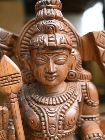 A detailed shot of the face of the 24-inch Murugan statue, capturing his calm and powerful expression.