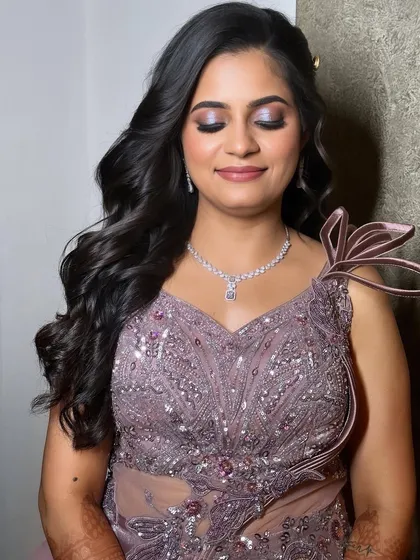A close-up of the eye makeup, showing the beautiful blend of purple and silver shimmers that make her eyes pop.