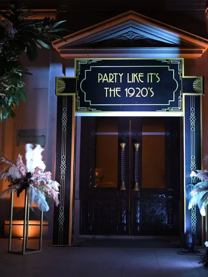 I love executing a strong theme. For this corporate gala, we went all-in on a 1920s Gatsby theme, starting with an immersive entrance that instantly transported guests to another era.