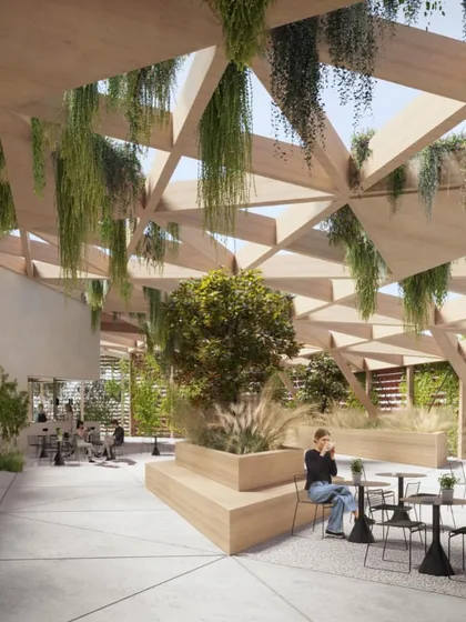 The interior of the rooftop garden, a space designed for relaxation and social interaction, filled with natural light and lush greenery.