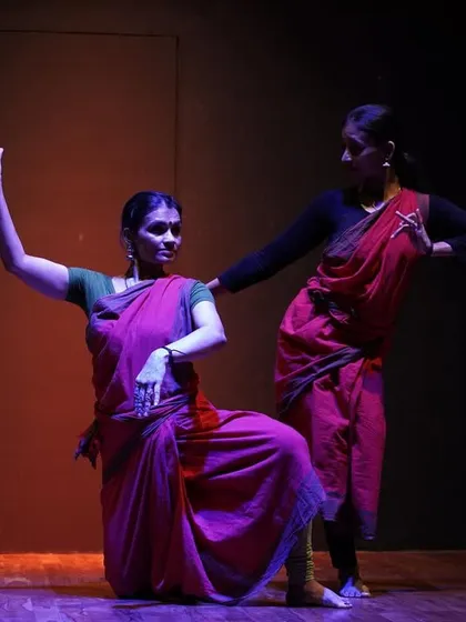 The dramatic lighting and shadows create a powerful mood in this scene from "ANATAH:", highlighting the dancers' forms and emotions.