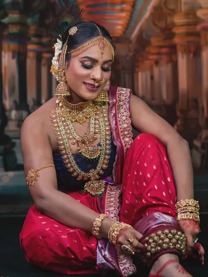 A full view of the dancer's pose, adorned in my complete temple jewellery set. The ghungroo and traditional attire show how my pieces are also suitable for classical dance performances.