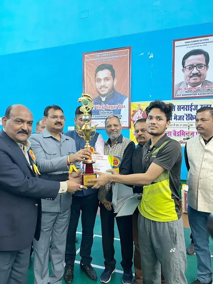 A proud moment as our player Akash Singh receives his trophy for securing the runner-up position in the Men's Singles category at the Uttar Pradesh Badminton Championship.