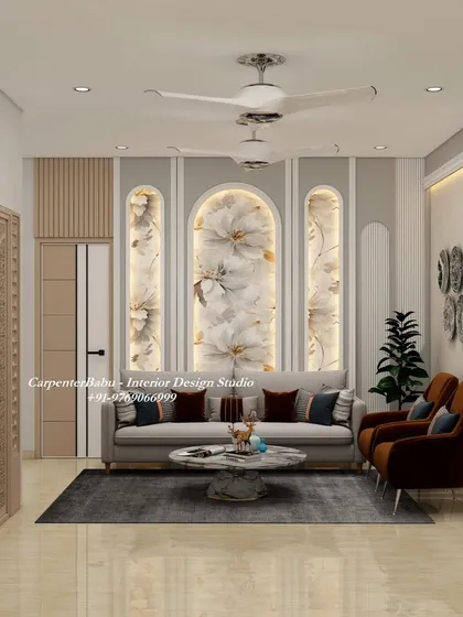 A living room featuring backlit arched panels with floral wallpaper. This design softens the space and adds a touch of romantic elegance, perfectly complementing the modern furniture.