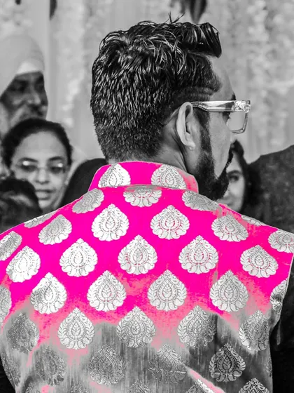 A different perspective of me hosting an event. Even from the back, you can see the engagement with the crowd, which is the most important part of my job as a wedding emcee.