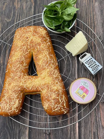 A savoury version of my initial pull-apart bread, this 'A' is made with my pesto cheese recipe and topped with grated parmesan.