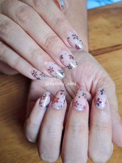 A delicate and elegant design featuring chrome floral patterns. The semi-transparent flowers on a nude base create a beautiful, stained-glass effect.