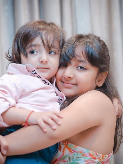 A tight hug between a brother and sister. These are the moments you'll look back on and smile for years to come.