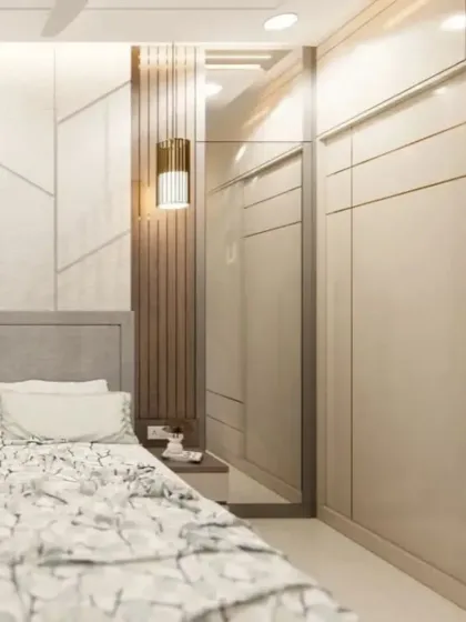 This angle highlights the mirrored panel next to the wardrobe, a great trick to make the room feel larger and brighter.