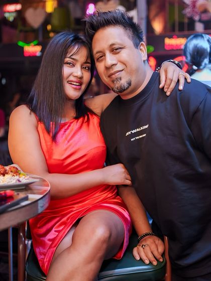 A couple enjoying the night. My gigs are great for a fun date night or a group outing.