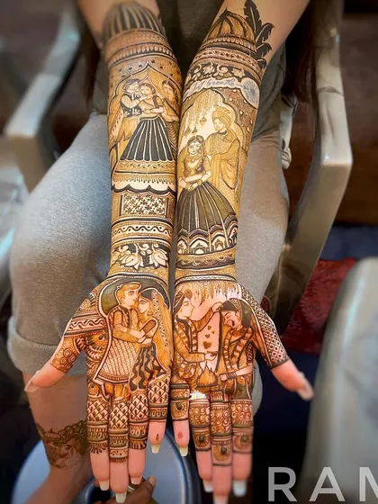 A complete bridal mehndi story across both arms. I designed multiple scenes for this bride, including couple portraits for the palms and different moments from her love story on the forearms. Every element is drawn with care to tell a cohesive story.