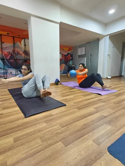 Yoga is not just about stretching; it's also about building functional strength. Here, we use stability balls to engage the core, which is the center of our power and vitality. This variation adds a playful challenge while strengthening the entire body.