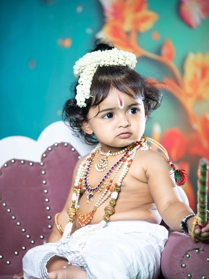 A thoughtful little Krishna, looking serene and divine.