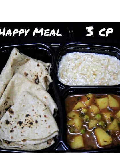 The 3-compartment meal is perfect for a light lunch, featuring phulkas, a sabzi, and a sweet dish.
