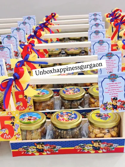 This shot showcases the colorful ribbons and custom 'Paw Patrol' tags that make these fifth birthday favors so special.