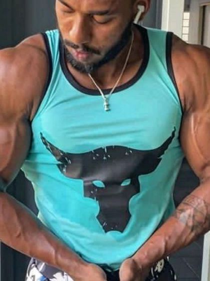 Another powerful pose showing off the bicep and forearm development achieved during his muscle-building phase.