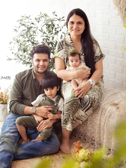 Now a beautiful family of four. It's wonderful to capture the growing family and the sweet interaction between the two siblings.